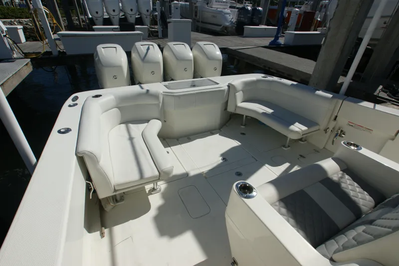 Slide: The Image of 2018 SeaVee 390Z boat interior with white seating and multiple outboard engines. - 11