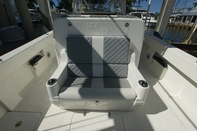 Slide: The Image of 2018 SeaVee 390Z boat seating area with quilted upholstery and cup holders. - 12