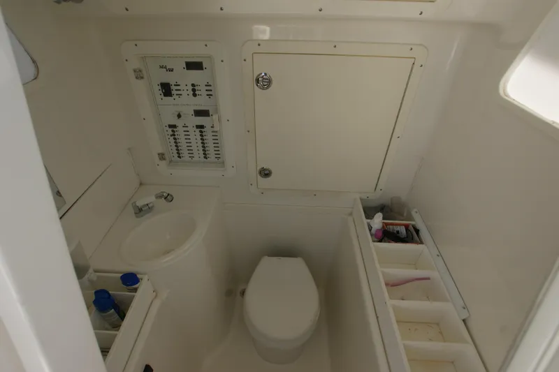Slide: The Image of 2018 SeaVee 390Z boat bathroom with toilet, sink, and storage compartments. - 15