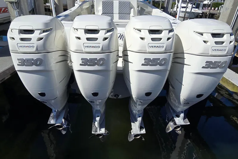 Slide: The Image of Four Verado 350 outboard engines on a 2018 SeaVee 390Z boat at a dock. - 3