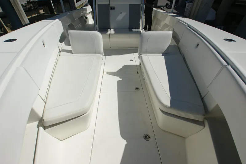 Slide: The Image of 2018 SeaVee 390Z boat interior with white cushioned seating and spacious deck. - 8
