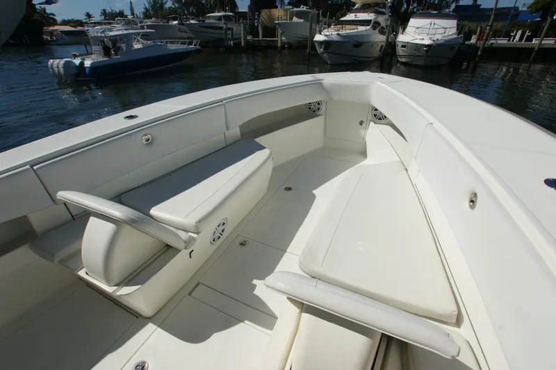 Slide: The Image of 2018 SeaVee 390Z boat interior with white seating and spacious deck. - 9