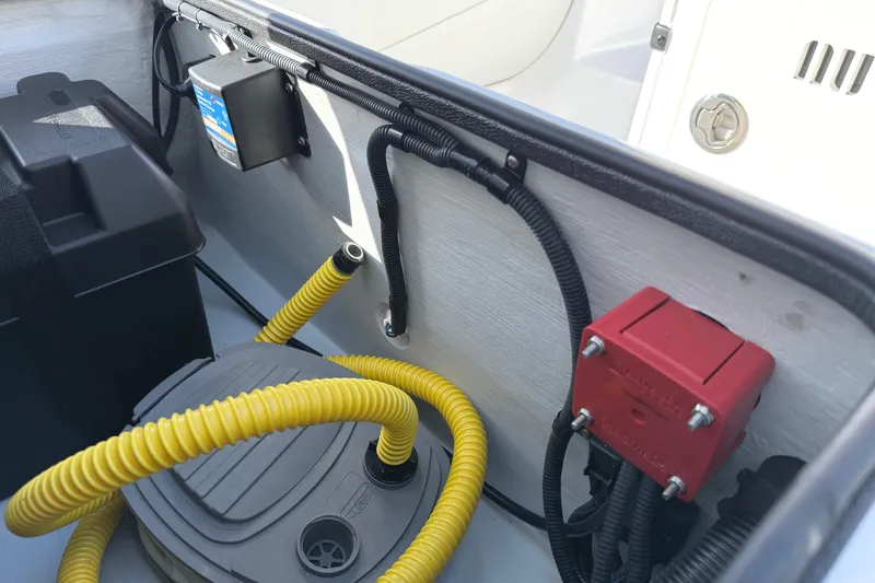 Slide: The Image of Interior view of a 2021 Novurania Deluxe 335 boat showing wiring and components. - 14