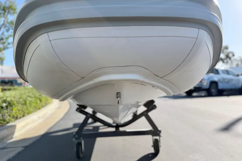 Slide: The Image of 2021 Novurania Deluxe 335 boat on a wheeled stand, viewed from below. - 20