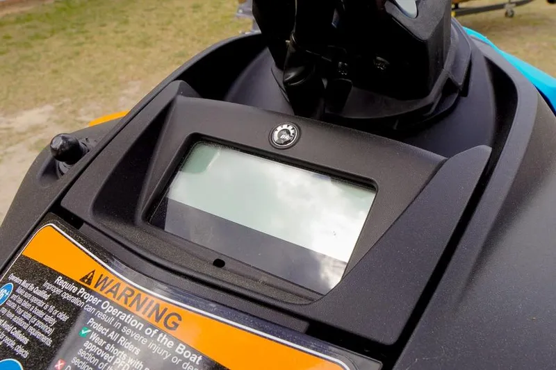 Slide: The Image of 2026 Sea-Doo Spark Trixx dashboard with warning label and display screen. - 12