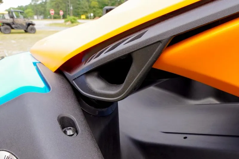 Slide: The Image of Close-up of 2026 Sea-Doo Spark Trixx for 1, showcasing vibrant orange and blue design. - 16