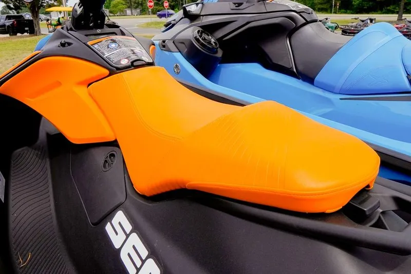Slide: The Image of 2026 Sea-Doo Spark Trixx with vibrant orange seat, showcasing sleek design and comfort. - 4