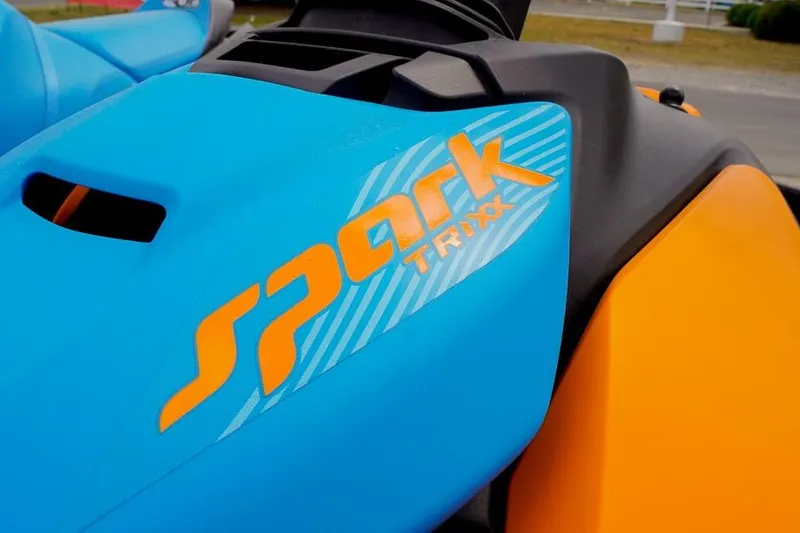 Slide: The Image of 2026 Sea-Doo Spark Trixx jet ski, vibrant blue and orange design. - 8
