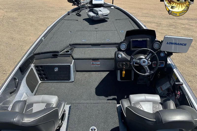 Slide: The Image of 2019 Nitro Z21 boat interior with steering wheel, Lowrance electronics, and seating. - 4