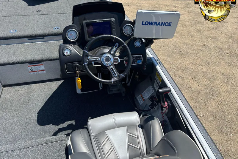 Slide: The Image of 2019 Nitro Z21 boat cockpit with steering wheel and Lowrance display. - 7