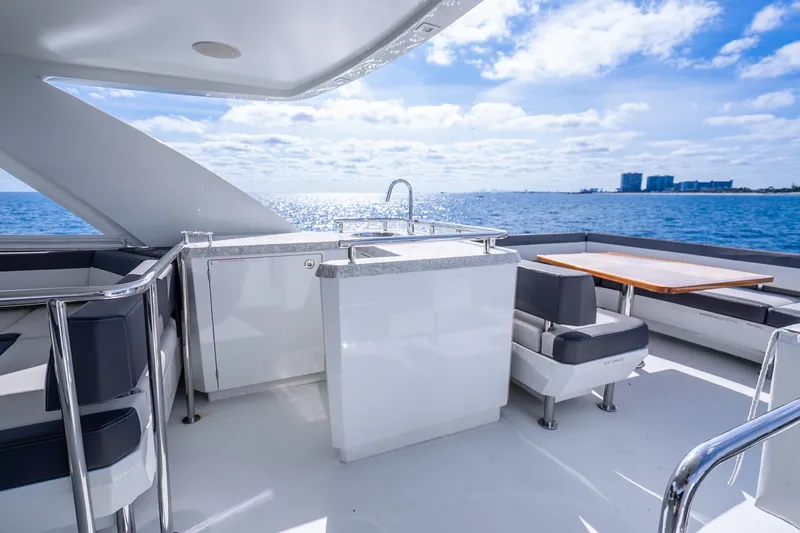 Slide: The Image of Luxurious 2021 Ocean Alexander 70E Motoryacht deck with seating and ocean view. - 17