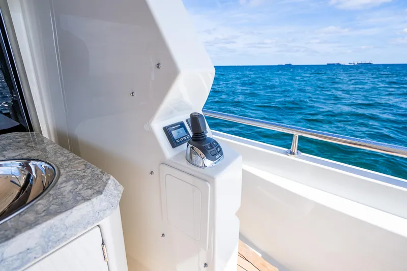 Slide: The Image of 2021 Ocean Alexander 70E Motoryacht helm station with ocean view. - 26