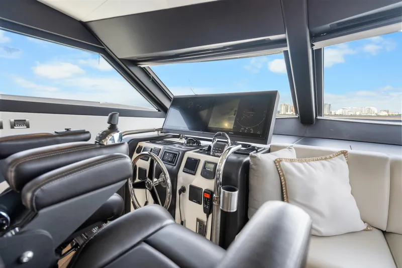 Slide: The Image of Interior helm of 2021 Ocean Alexander 70E Motoryacht with modern controls and panoramic view. - 35