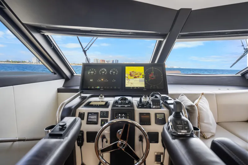 Slide: The Image of Cockpit of 2021 Ocean Alexander 70E Motoryacht with navigation screens and steering wheel. - 36