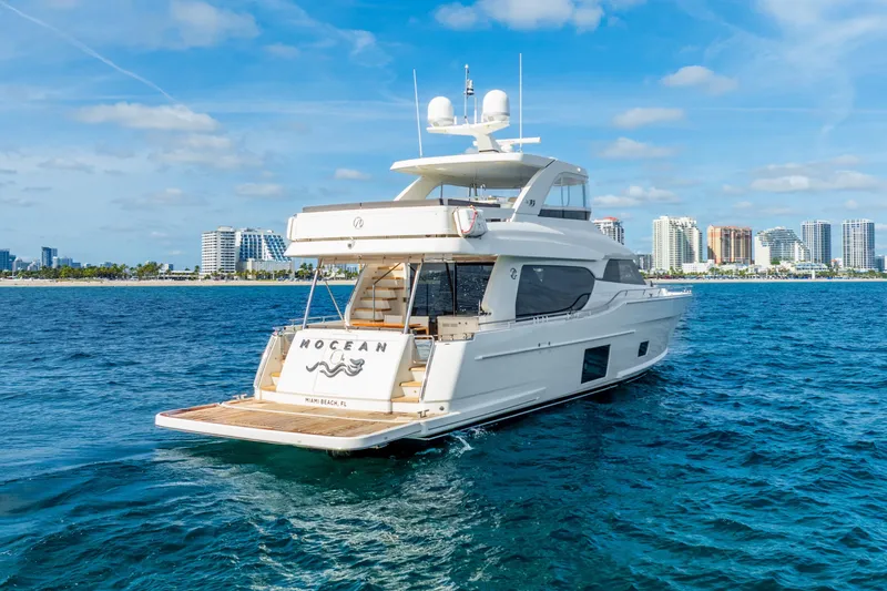 Slide: The Image of 2021 Ocean Alexander 70E Motoryacht cruising near Miami Beach skyline. - 4