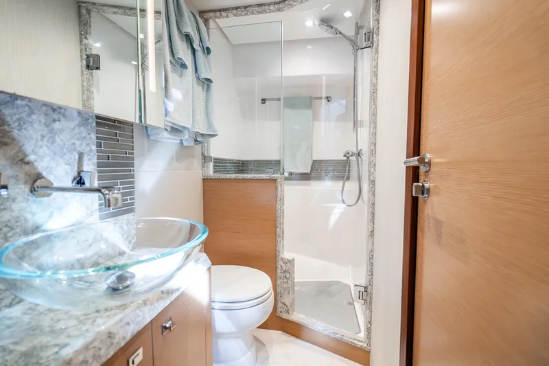 Slide: The Image of Luxurious bathroom in 2021 Ocean Alexander 70E Motoryacht with glass sink and modern shower. - 48