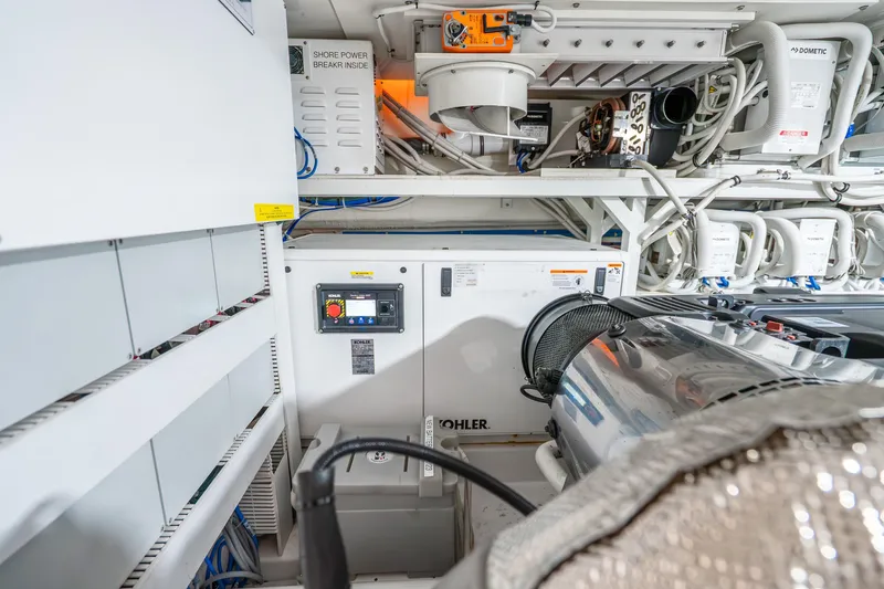 Slide: The Image of Engine room of 2021 Ocean Alexander 70E Motoryacht with Kohler generator and electrical systems. - 63