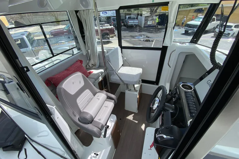 Slide: The Image of Interior of 2026 Jeanneau NC Sport 795 Series 2 boat, featuring modern helm and seating. - 25