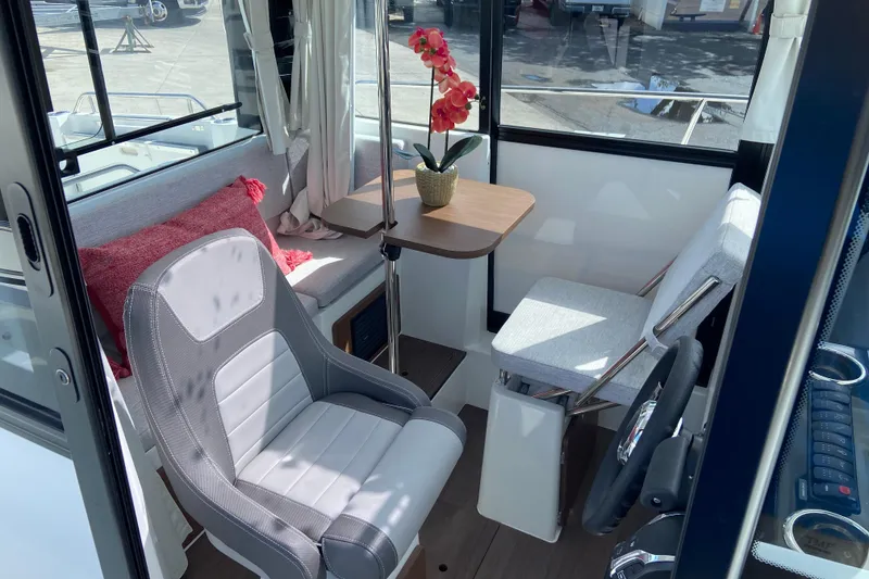 Slide: The Image of Interior of 2026 Jeanneau NC Sport 795 Series 2 boat with seating and table. - 26