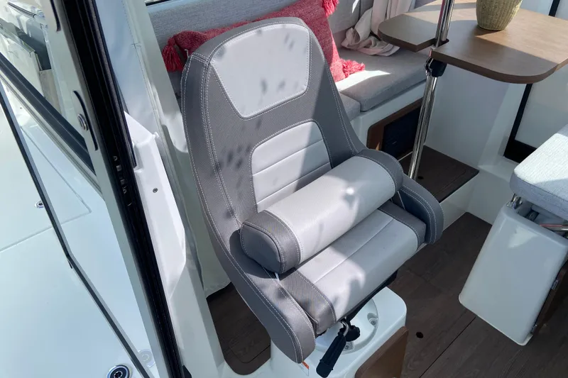 Slide: The Image of Captain's seat in 2026 Jeanneau NC Sport 795 Series 2 boat interior. - 28