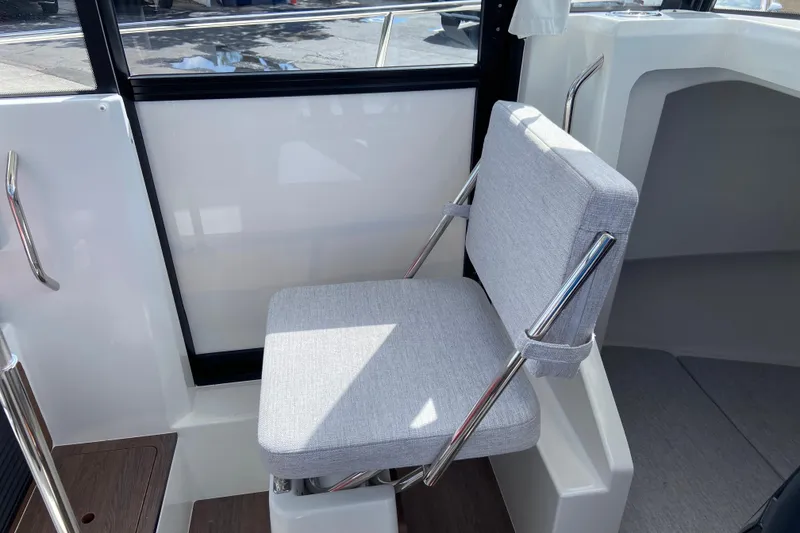 Slide: The Image of 2026 Jeanneau NC Sport 795 Series 2 interior with cushioned seating and modern design. - 32