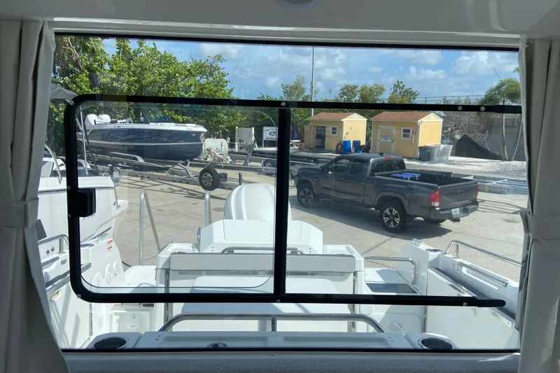 Slide: The Image of View from Jeanneau NC Sport 795 Series 2 boat, showing marina and parked vehicles. - 36