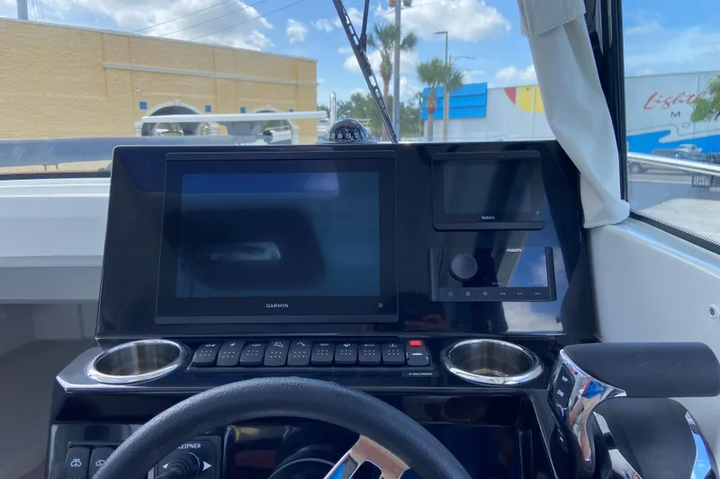 Slide: The Image of Dashboard of 2026 Jeanneau NC Sport 795 Series 2 with Garmin display and controls. - 38