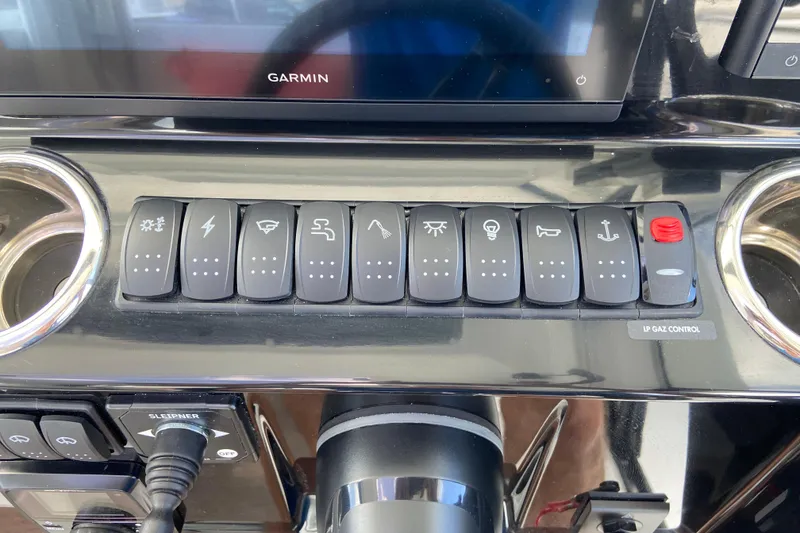 Slide: The Image of Control panel of 2026 Jeanneau NC Sport 795 Series 2 boat with labeled switches. - 40