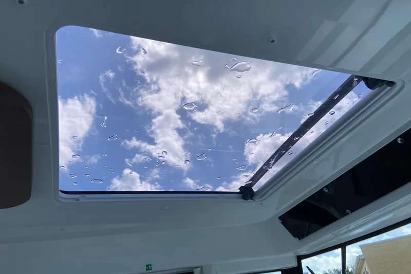 Slide: The Image of Skylight view from Jeanneau NC Sport 795 Series 2, 2026, showing blue sky and clouds. - 44