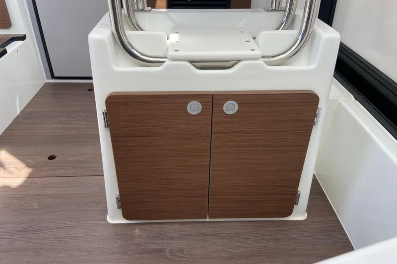 Slide: The Image of 2026 Jeanneau NC Sport 795 Series 2 interior with wooden cabinet doors. - 47