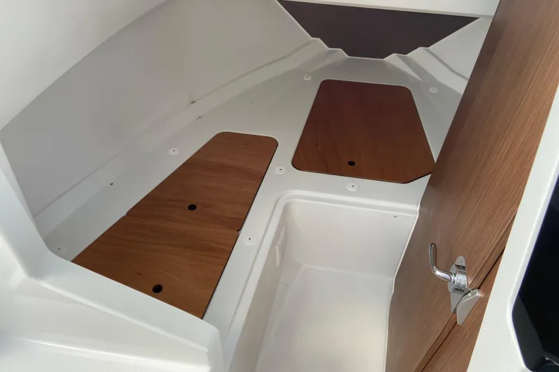 Slide: The Image of Interior cabin of 2026 Jeanneau NC Sport 795 Series 2 boat, featuring wooden accents. - 52