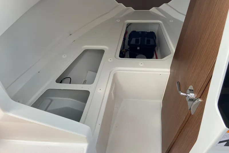 Slide: The Image of Interior cabin of 2026 Jeanneau NC Sport 795 Series 2 boat, featuring storage compartments. - 53