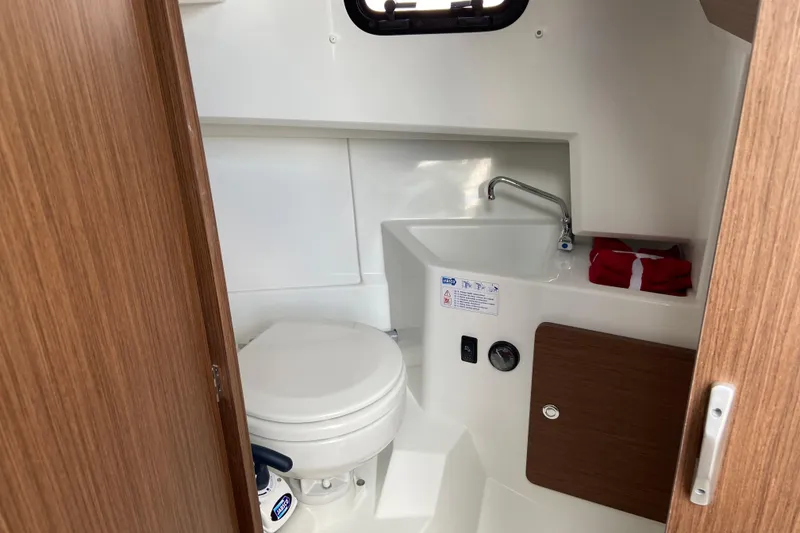 Slide: The Image of 2026 Jeanneau NC Sport 795 Series 2 boat bathroom with toilet and sink. - 55