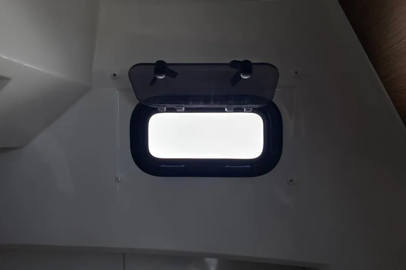 Slide: The Image of Porthole window inside 2026 Jeanneau NC Sport 795 Series 2 boat cabin. - 58