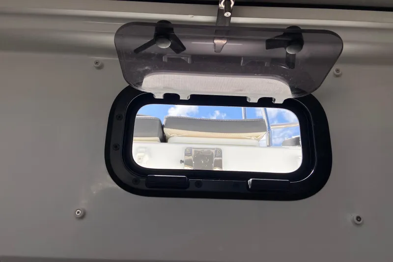 Slide: The Image of Porthole view from Jeanneau NC Sport 795 Series 2, 2026 model, showing clear sky. - 61