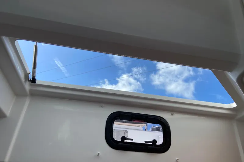 Slide: The Image of Interior view of Jeanneau NC Sport 795 Series 2, showcasing skylight and window, 2026 model. - 63