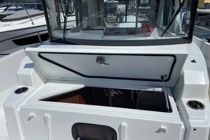 Slide: The Image of 2026 Jeanneau NC Sport 795 Series 2 boat with open storage compartment. - 64