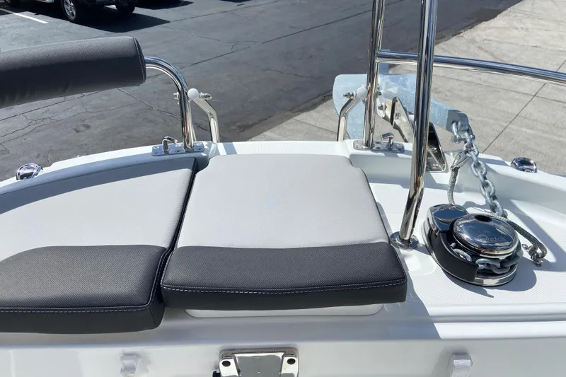 Slide: The Image of 2026 Jeanneau NC Sport 795 Series 2 boat deck with cushioned seating and anchor chain. - 69