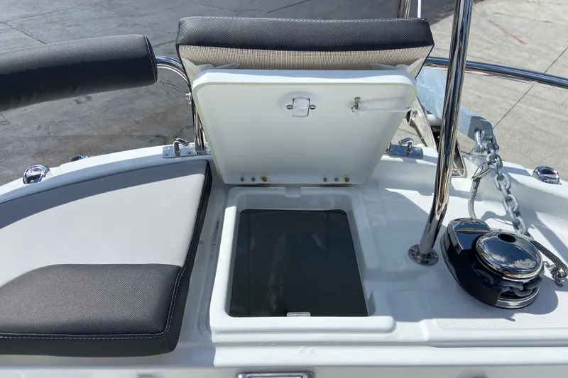 Slide: The Image of 2026 Jeanneau NC Sport 795 Series 2 boat deck with open storage compartment and anchor chain. - 70