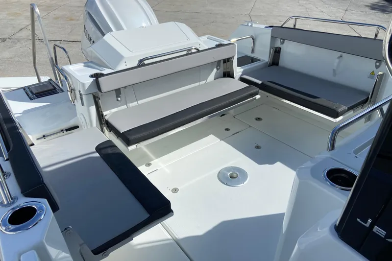 Slide: The Image of 2026 Jeanneau NC Sport 795 Series 2 boat interior with seating and motor. - 8
