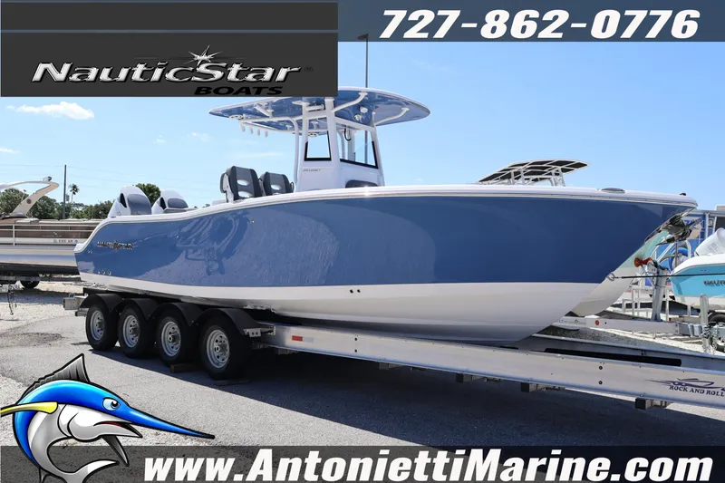 The Image of 2026 NauticStar 292 Legacy boat on trailer at Antonietti Marine dealership. - 1