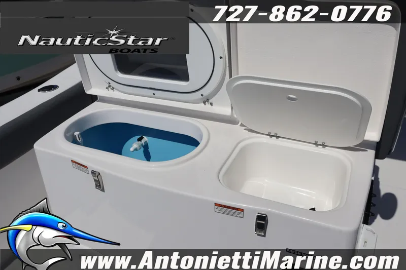 Slide: The Image of NauticStar 292 Legacy 2026 boat with open storage compartments, featuring contact details and logo. - 12
