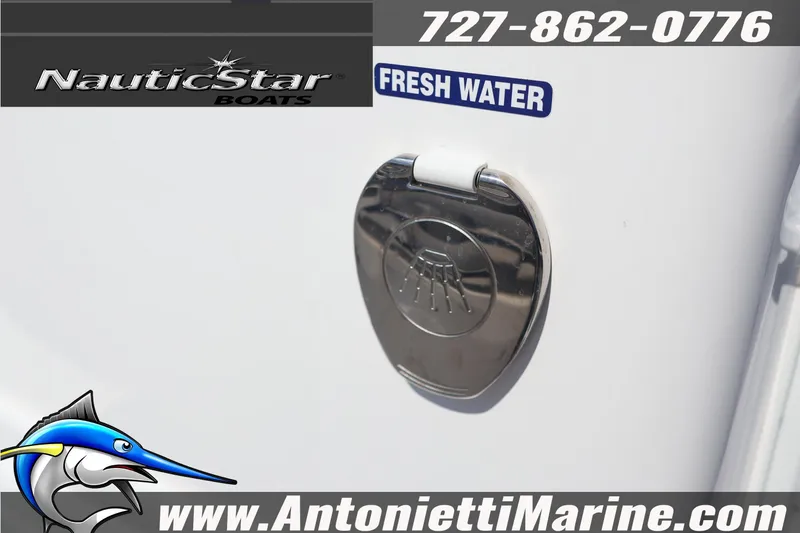 Slide: The Image of NauticStar 292 Legacy 2026 boat with fresh water access and contact details. - 13