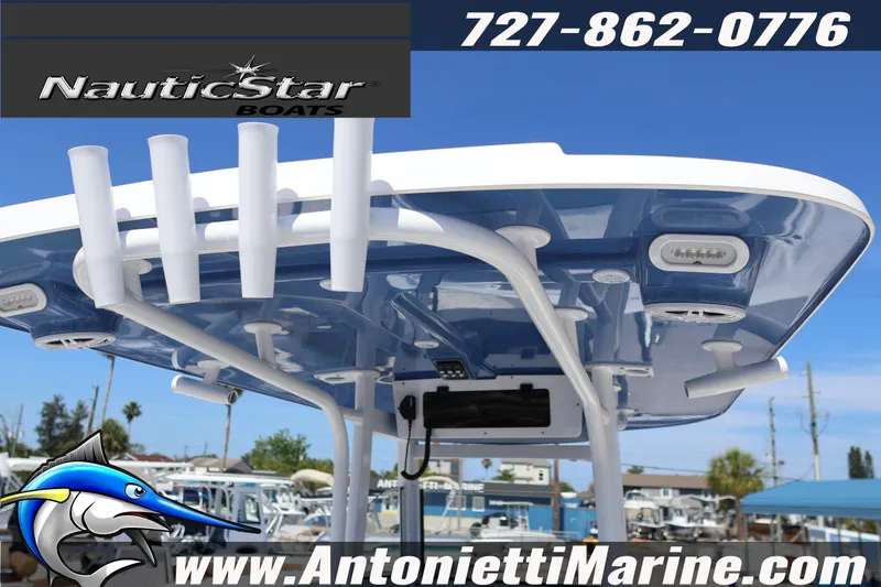 Slide: The Image of NauticStar 292 Legacy 2026 boat top view with rod holders and contact details. - 15