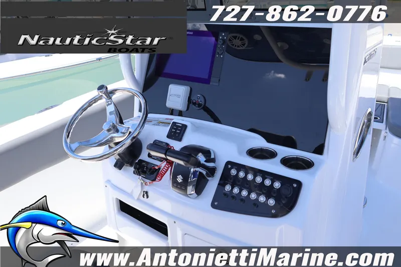 Slide: The Image of 2026 NauticStar 292 Legacy boat dashboard with steering wheel and controls. - 16