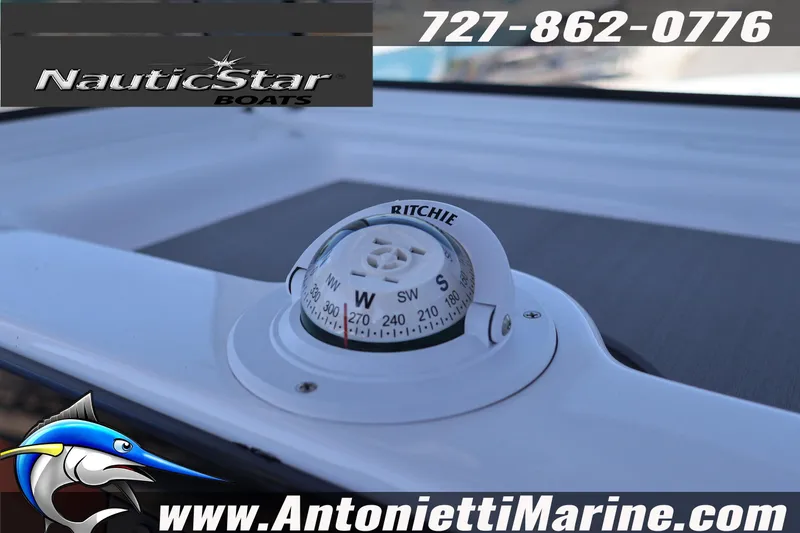 Slide: The Image of Compass on NauticStar 292 Legacy boat, featuring Ritchie navigation, Antonietti Marine branding. - 18