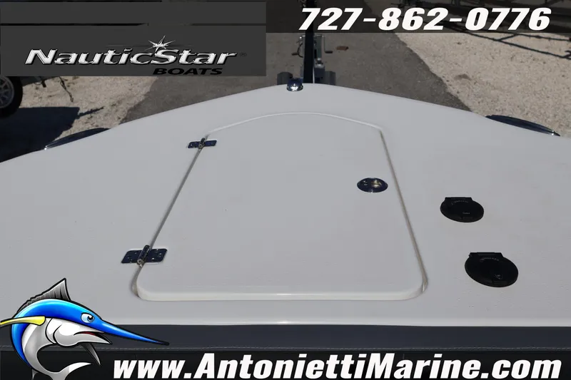 Slide: The Image of 2026 NauticStar 292 Legacy boat deck with logo and contact information. - 26