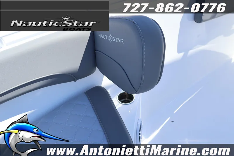 Slide: The Image of 2026 NauticStar 292 Legacy boat seat detail with logo and contact information. - 31