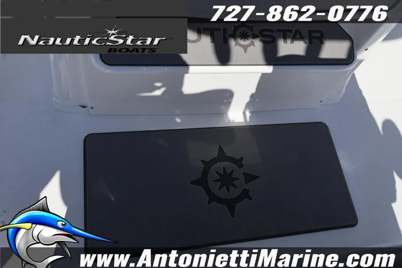 Slide: The Image of 2026 NauticStar 292 Legacy boat deck with logo and contact details. - 35