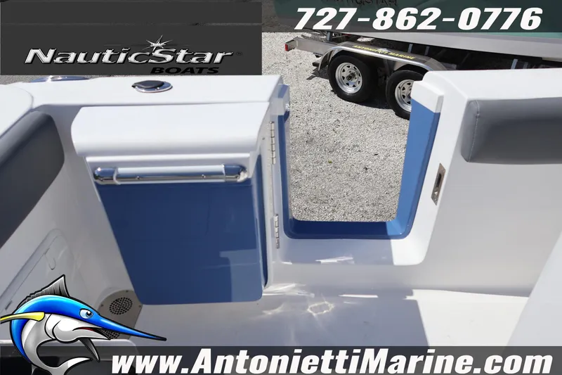 Slide: The Image of 2026 NauticStar 292 Legacy boat entryway with blue accents, displayed by Antonietti Marine. - 37